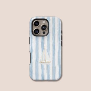 May include: A smartphone case with a nautical design. It has a blue and white striped pattern and a watercolour illustration of a sailboat. The case has a glossy finish and a black camera surround.