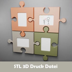 Peut inclure: Ensemble de quatre cadres photo en forme de puzzle, dans des tons pêche, gris et vert. Un cadre contient un dessin simple de deux personnages bâtons. Le texte "STL 3D Druck Datei" est au bas de l'image.