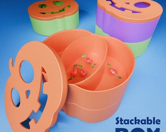 Könnte beinhalten: Orange, stapelbare Boxen in Kürbisform mit eingeschnitzten Gesichtern. Eine Box ist geöffnet und zeigt Süßigkeiten. Der Text "Stackable BOX" ist in Weiß dargestellt. Weitere Boxen sind grün und lila.