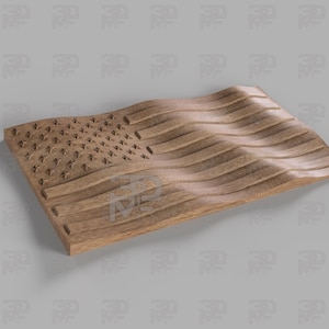 May include: A wooden carving of the American flag. The design includes stars and stripes, with a three-dimensional, undulating effect. The wood is a natural, light brown colour.
