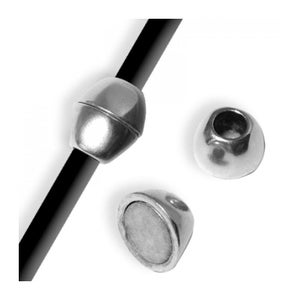 May include: Silver-toned magnetic clasp components. One clasp is attached to a black cord, while two additional components are displayed separately. The clasps have a rounded, conical shape with a magnetic interior.