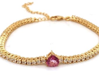 Tennisarmband i sterlingsilver med naturligt rosa topas och hjärta. Present till årsdagar.