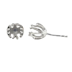 May include: Two silver-colored earring settings, each featuring a multi-pronged basket design intended to hold a gemstone. One setting is viewed from the top, showing the circular arrangement of prongs, while the other is shown from the side.