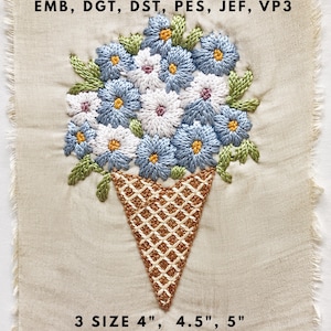 Könnte beinhalten: Gesticktes Blumendesign mit blauen, weißen und gelben Blumen in einer braunen Tüte. Das Design befindet sich auf einem beigefarbenen Stoff. Der Text unten lautet "3 GRÖSSEN 4", 4.5", 5""