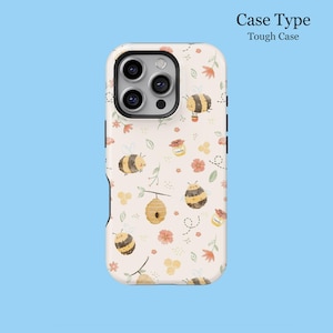 May include: A tough phone case with a cream background featuring a repeating pattern of cartoon bees, flowers, honey pots, and a beehive. The case has a black camera cutout and the text "Case Type Tough Case".