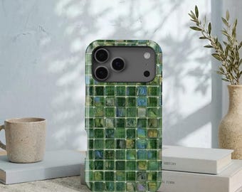 May include: A smartphone case featuring a grid pattern of small, square, glossy tiles in various shades of forest green, olive, and hints of blue. The case has a rectangular camera cutout at the top, revealing a dark grey camera lens array.