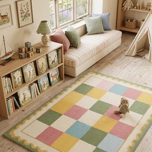 Soft pastel checkerboard nursery rug with scalloped border in pink, sage green, cream, yellow, and baby blue, styled in a cozy rainbow-themed kids room with plush tufted texture.