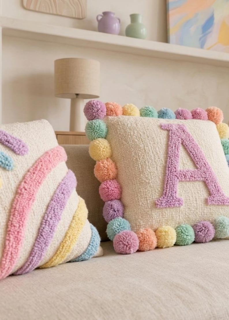 Close-up of handmade tufted cushion cover showing soft plush texture, pastel yarn details, and premium handcrafted workmanship.