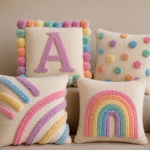 Personalized tufted cushion cover with pastel pom pom border, custom initial letter pillow, handmade nursery and kids room decor.