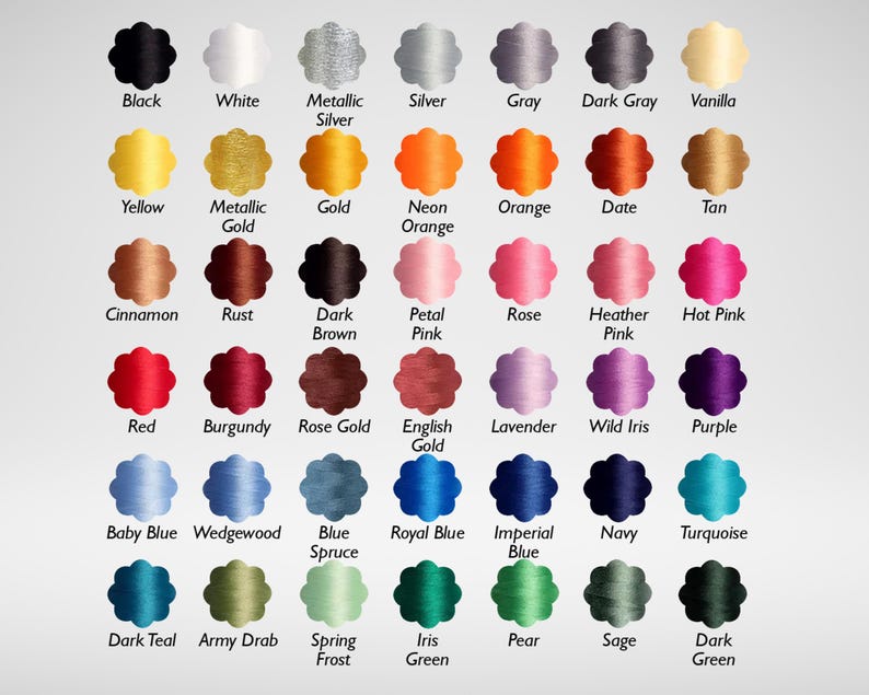 May include: A color chart featuring a variety of thread colors. The chart displays a range of hues, including black, white, metallic silver, and various shades of yellow, orange, pink, red, blue, green, and purple. Each color is labeled with its name.
