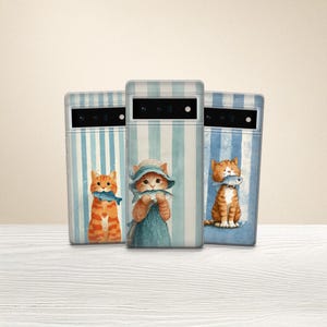May include: Three phone cases with a blue and white striped background. Each case features a watercolor illustration of a ginger cat holding a fish. One cat wears a blue hat and dress.