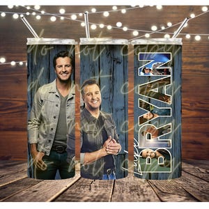 May include: Three stainless steel insulated tumblers with straws. Each tumbler features a different image of a smiling man, with the name "BRYAN" in white lettering on one. The background is a blue wood grain design.