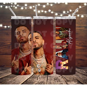 May include: Three stainless steel tumblers with straws. Each tumbler features a portrait of a man in a red jacket, with the name "Alejandro" and the word "Love" in a purple and orange design.