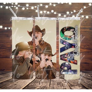 May include: A set of three beige insulated tumblers featuring images of a musical group. The tumblers have a silver straw and the text "Grupo Frontera" is visible on one of the tumblers.