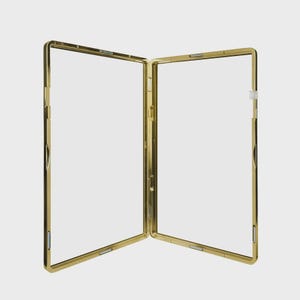 May include: A gold-colored, hinged picture frame, open to reveal two clear panels. The frame has a rectangular shape with rounded corners and a shiny finish. The frame is designed to display two photos or images.