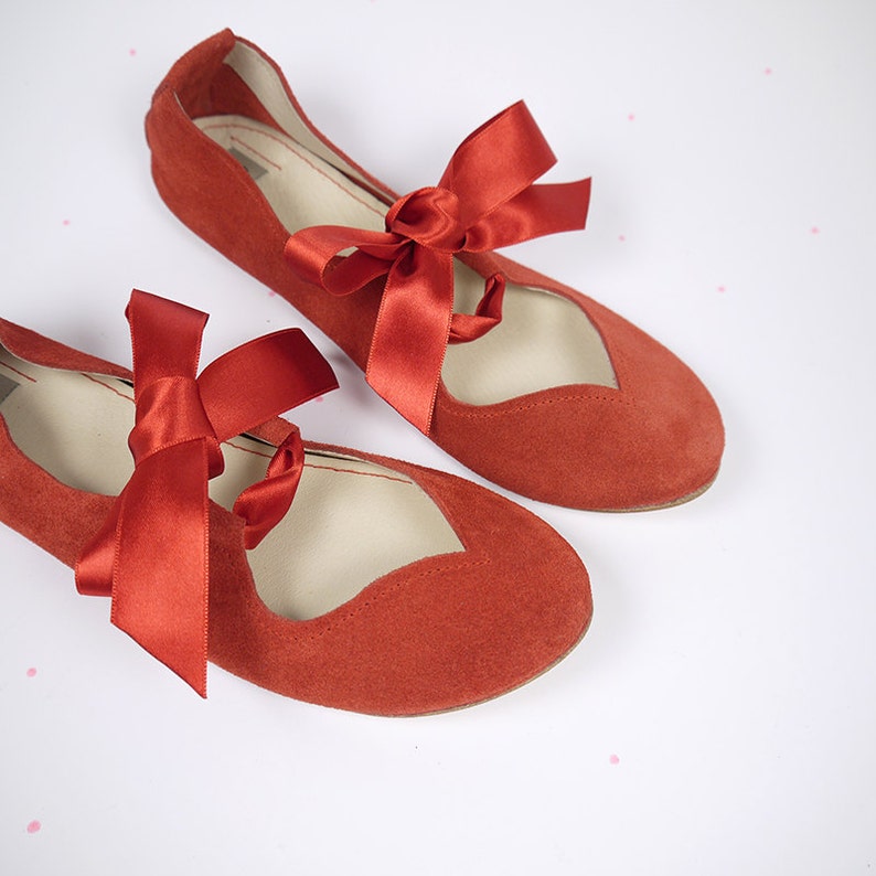 red ballet shoes with ribbons