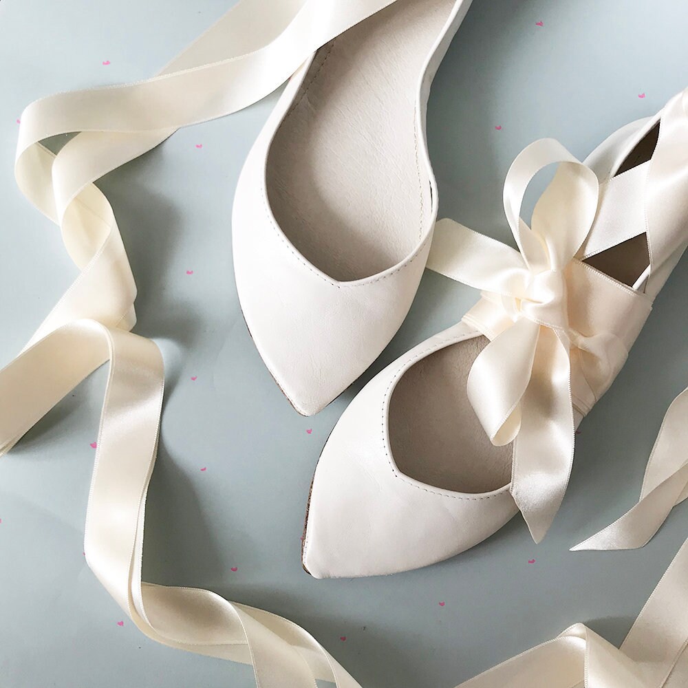 white satin ballet shoes with ribbon