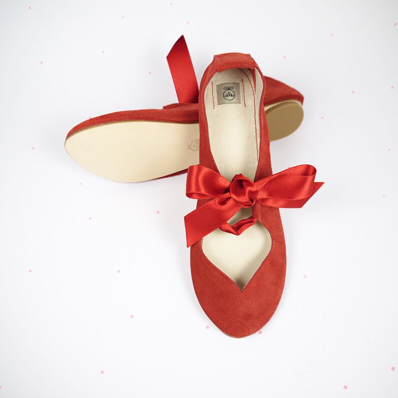 red ballet shoes with ribbons