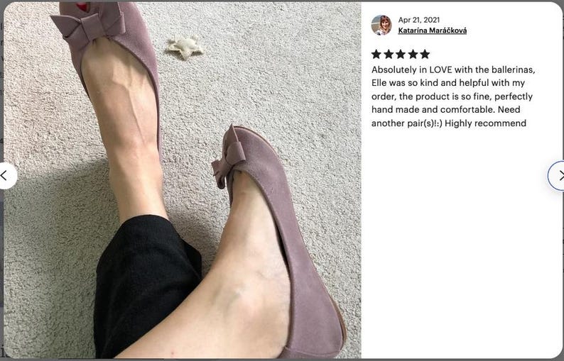 May include: A pair of mauve ballet flats with a bow on the toe. The shoes are made of suede and have a comfortable fit.