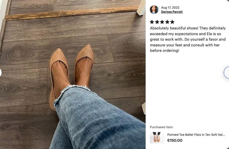 May include: A pair of tan pointed toe ballet flats worn by a person with blue jeans. The shoes are on a wooden floor. The text "Pointed Toe Ballet Flats in Tan Soft Ital... &euro;150.00" is visible.