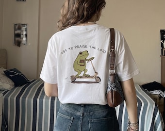 Praying Frog on Scooter T-Shirt | Off to Praise the Lord Back Print