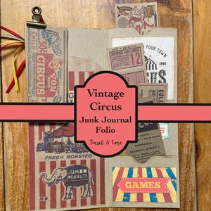 May include: A tan paper junk journal folio featuring vintage circus-themed ephemera, including tickets, a peanut advertisement, and game signage. The folio is held together by a metal clip and decorated with red, yellow, and blue ribbons.