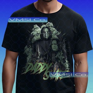 May include: Black t-shirt featuring a graphic of two figures with a wand, and the text "Daddy's Snape" in green. The design includes a castle and smoke effects. The shirt has the text "VMSI Co." in a blue rectangle.