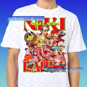 May include: White t-shirt with a graphic design dedicated to Niki Lauda, a Formula 1 racing driver. The design includes his name in red and yellow, images of Lauda, a race car, and a checkered flag.