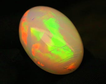 Ópalo etíope natural de 35,4 ct / Cabujón ovalado llamativo con fuego verde eléctrico y naranja / Piedra preciosa de ópalo Welo XL / 27 x 19 mm / Gema de colección