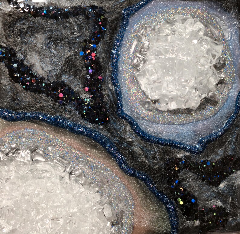 May include: A set of three ceramic mugs with a speckled, matte finish. The mugs are in shades of cream, light gray, and dark gray. Each mug has a simple, minimalist design, perfect for coffee or tea.