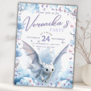 May include: A party invitation featuring a white dragon soaring against a backdrop of blue and pink watercolor clouds and butterflies. The invitation includes the text "Please join us for Veronika's Party" with the date and time.