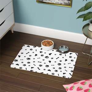Minimalist Pet Food Mat: Black & White Paw Print, Non-Slip 12x18