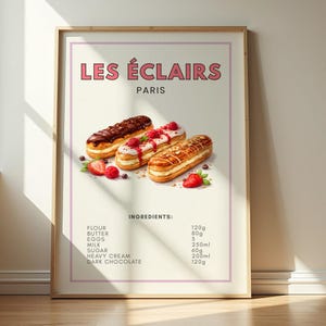 May include: A framed print displaying "LES ÉCLAIRS PARIS" and illustrations of three éclairs with chocolate, raspberry, and nut toppings. The ingredients are listed below, including flour, butter, eggs, milk, sugar, heavy cream, and dark chocolate.