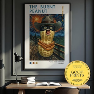 May include: Framed art print titled "THE BURNT PEANUT" featuring a peanut character in a cowboy hat, scarf, and mask, set against a stylized landscape. The print includes the text "SPERANZA 2181" and "MUSEE D'ART MODERNE DE PARIS". A circular sticker says "GOOP PRINTS".