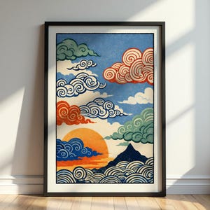 May include: Framed art print featuring a stylized landscape with a sunset, mountains, and swirling clouds. The artwork uses a palette of blue, orange, red, and green against a light blue sky. The print is in a black frame.
