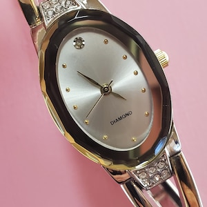 2000s Women&#39;s quartz Allude silver tone watch with crystal accents on silver tone bracelet