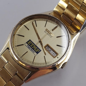 1981 Men&#39;s Seiko Quartz SQ day/date gold tone award watch on original stainless steel gold tone bracelet 7123-8469-P