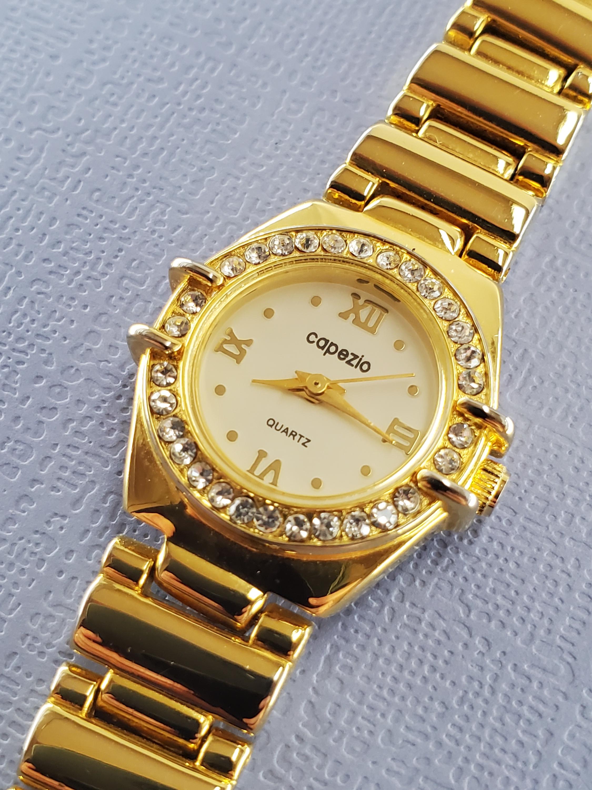 2000s Women's quartz Capezio gold tone with cut clear accent stones…