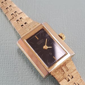1980s Women's Citizen Quartz Gold Tone Tank Style Watch on Gold