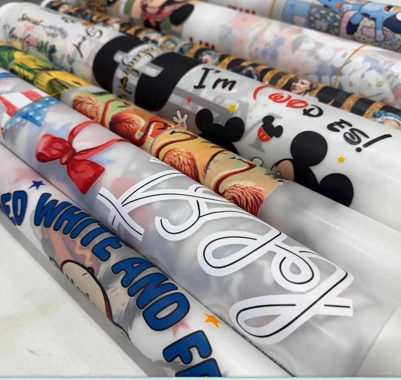 a collection of various printed materials, including wrapping paper, cards, and other decorative items, featuring a range of colorful designs and patterns.