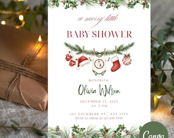 Könnte beinhalten: Eine weiße Babyparty-Einladung mit Weihnachtsmotto. Der Text lautet "a merry little BABY SHOWER" und enthält den Namen "Olivia Wilson". Die Einladung zeigt Illustrationen von Babykleidung und Weihnachtsdekorationen.