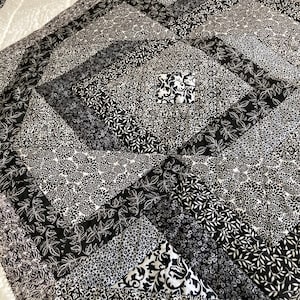Black and white throw quilt