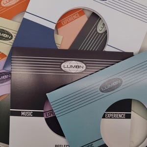May include: A collection of colorful CD sleeves with the "LUMON" logo and text like "MUSIC" and "EXPERIENCE". The sleeves are in various colors, including blue, orange, and purple, with a retro design.