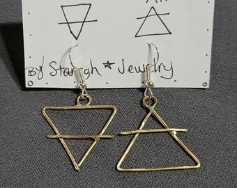 May include: Gold earrings with a triangle design representing the elements of earth and air. The earrings are on a white card with the words "Earth" and "Air" written on it. The card also has the text "By Starigh Jewelry".