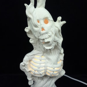 Ceramic Skeleton In A Tree Bisque (unfinished)