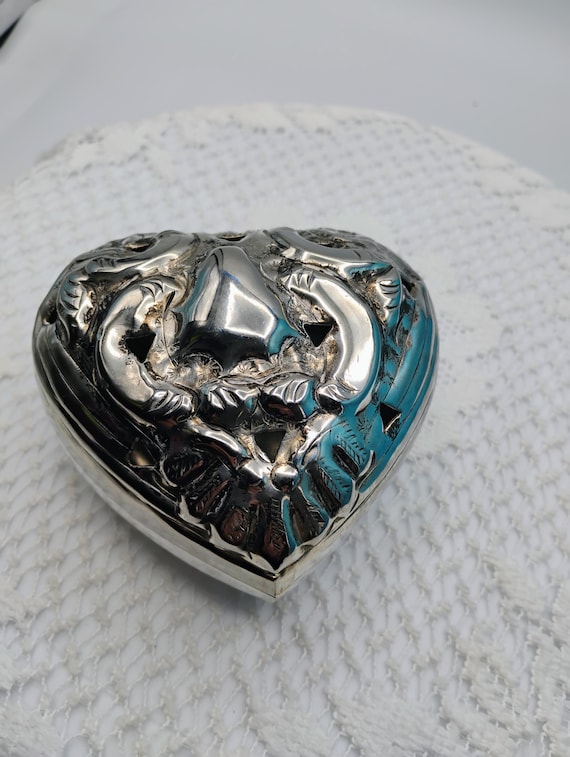 Vintage silver plated heart shaped trinket box.