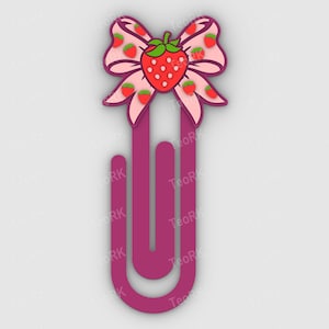 May include: A whimsical bookmark featuring a pink bow adorned with strawberries. The bow sits atop a magenta paperclip design. The strawberries have green leaves and red fruit. The bookmark is a charming accessory for book lovers.