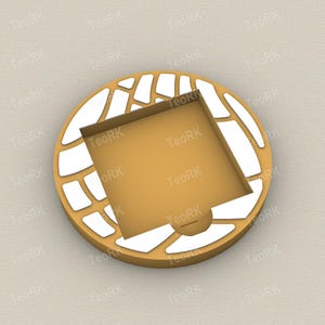 May include: A gold-colored, circular object with a square indentation in the center. The outer ring features a white, abstract pattern. The object has the text "TeoRK" repeated around the edge.
