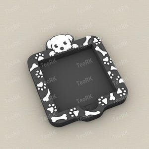 May include: Black phone case with a white dog and paw print design. The case has a square shape with rounded edges. The border is decorated with white paw prints and bones. A white dog peeks from the top.