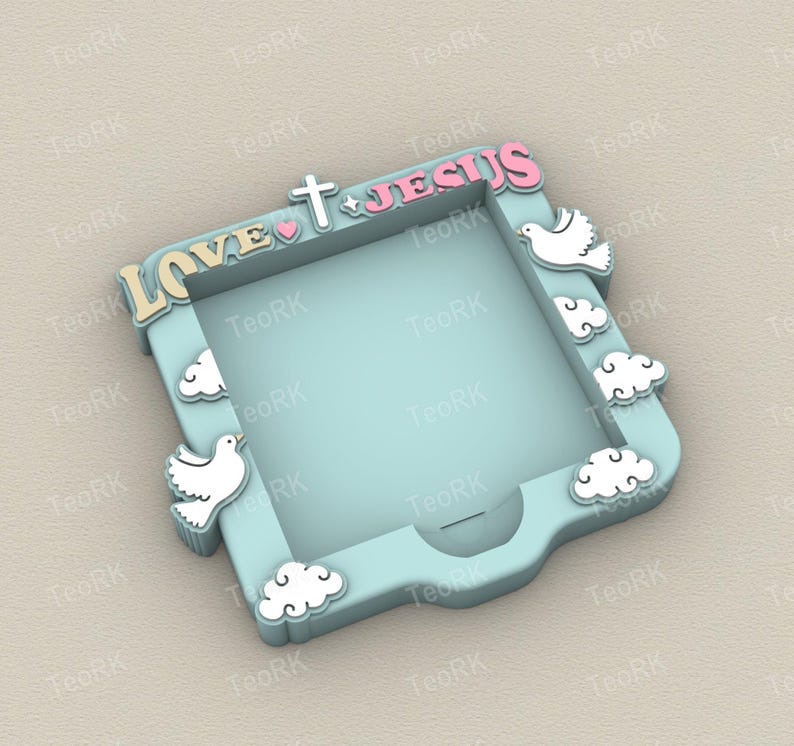 May include: A light blue decorative frame with the words "LOVE JESUS" in a playful font. The frame is adorned with white doves, clouds, a cross, and a heart. The frame is designed with a square opening.